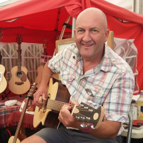 Yours truly with fanned-fret guitar worth about three grand