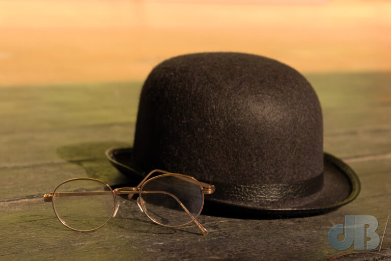 Spectacles and bowler hat