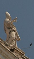 Papal statue plays air guitar